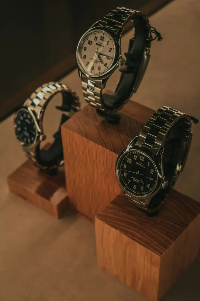 silver and black round analog watch
